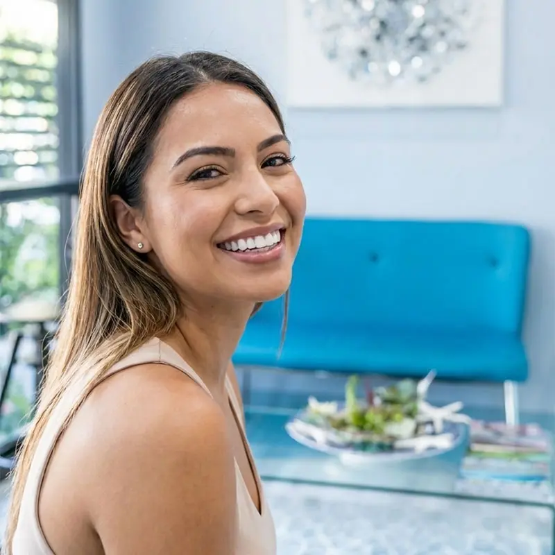 A woman smiling with beautiful, natural-looking teeth