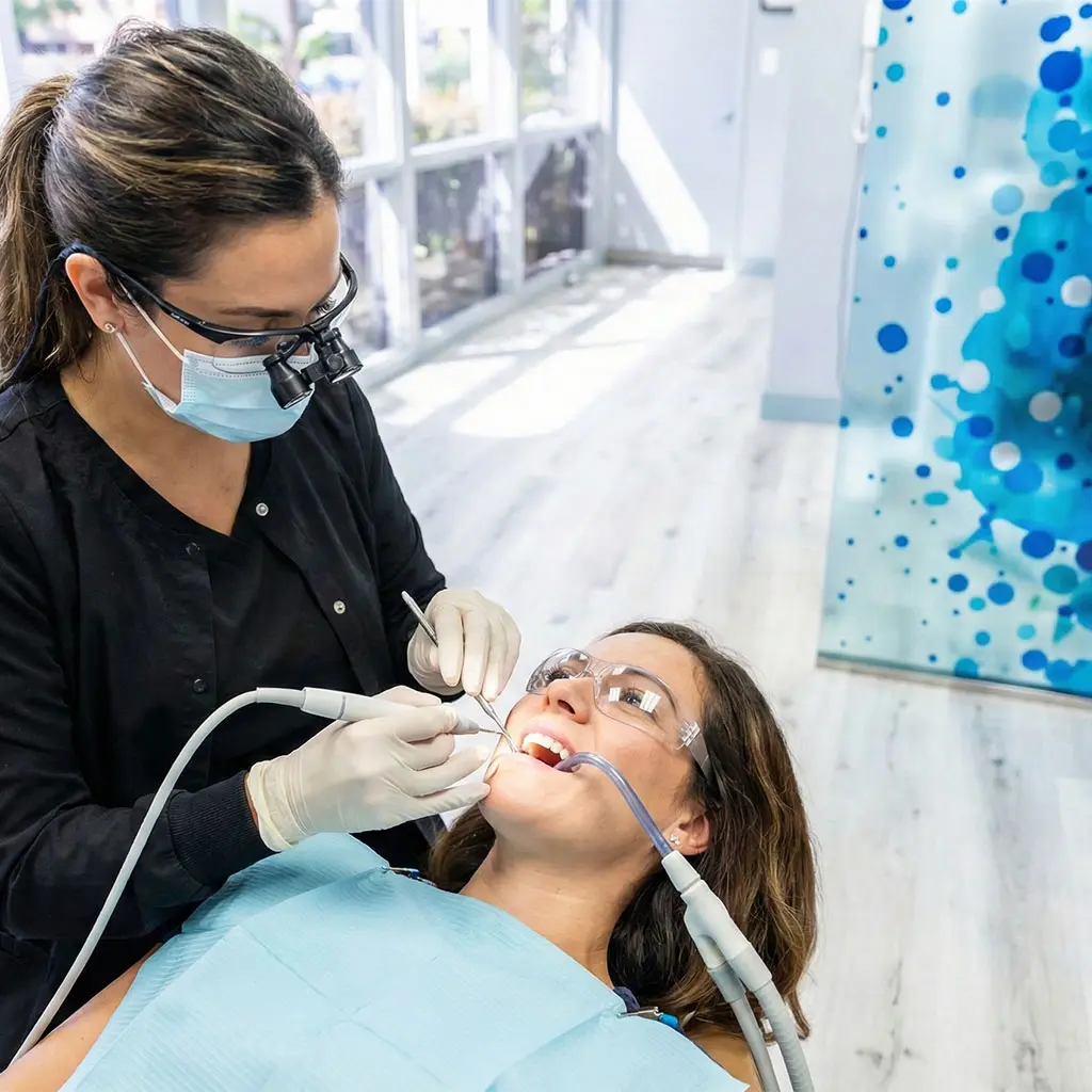 Dental hygienist performing a gentle cleaning